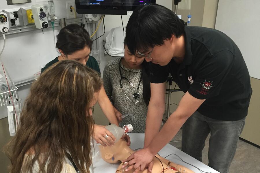 Healthcare professionals performing CPR on simulation mannequin