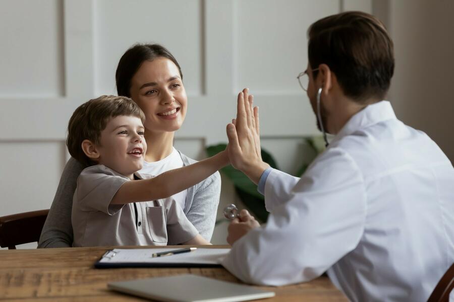Doctor giving his patient a high five