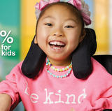 Young girl in wheelchair smiling