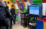 A young woman demonstrates a computer application