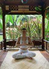 Iva sitting in seated yoga pose 