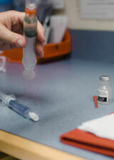 close up shot of healthcare provider adjusting needle