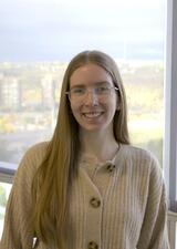 Colleen Griffith standing in front of window