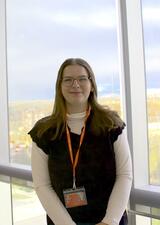 Becca McInnes standing in front of window