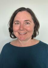 portrait of woman in teal shirt