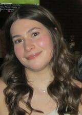 Smiling woman with long wavy brown hair