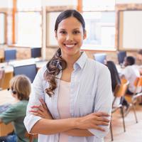 Teacher in classroom with children at their desks
