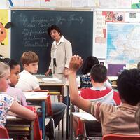 Teacher in classroom with students