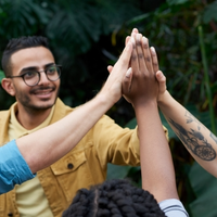 Adults raising and holding hands