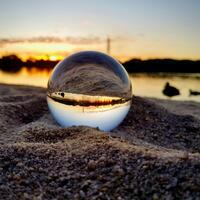 Glass sphere on a beachx