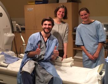 Happy volunteer undergoing scanning, 2019.