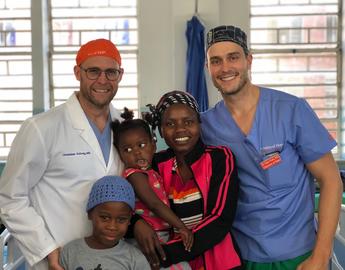 Dr. Schrag and Dr. Frank with Patients in Zimbabwe