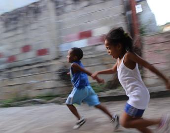 Children running on sidewalk