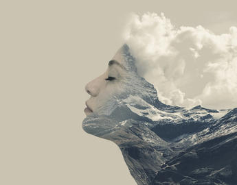 Woman leaning forward with clouds for hair